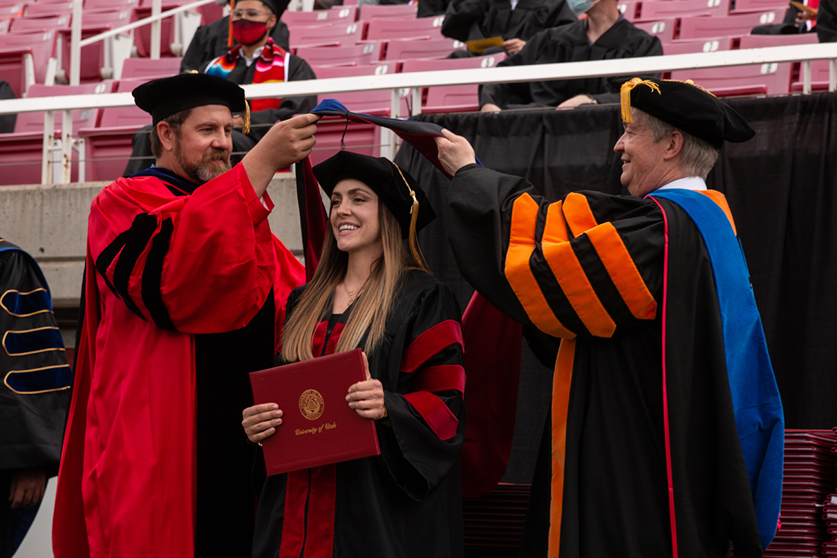 a student receives a Graduate Hood from two professors