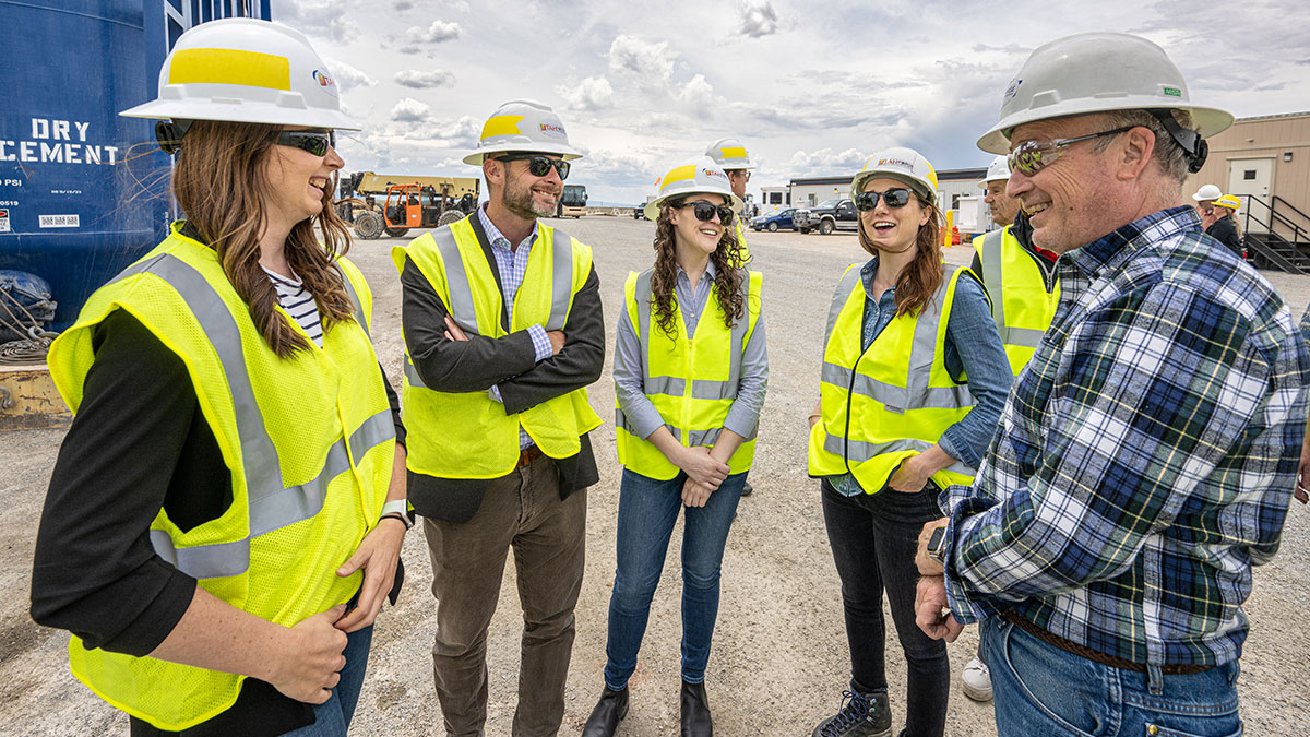 DOE Officials in safety vests and hard hats