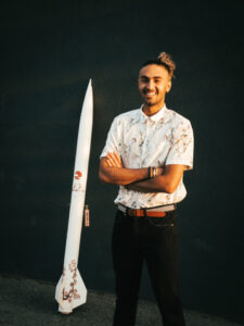  Kian Arian Ben-Jacob poses with a model rocket