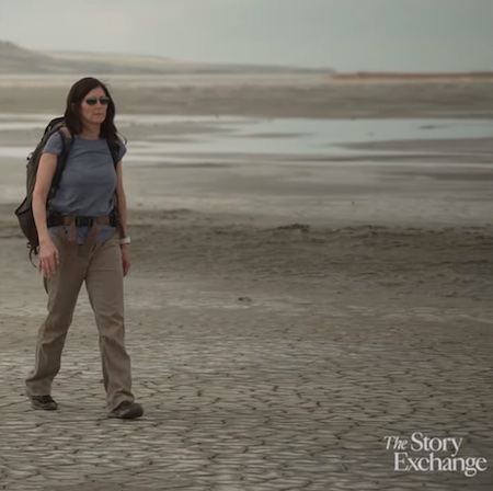 Kerry Kelly walks on a dry lake bed, in a still from a Story Exchange documentary on her work.