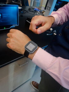 Benjamin Sanchez-Terrones demonstrating a cuffless blood pressure monitor.
