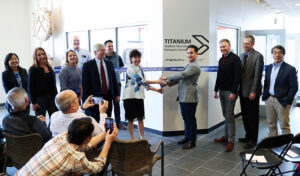 Members of IperionX and the Materials Science and Engineering Department cut the ribbon in front of a new lab.