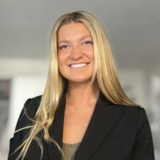 Headshot of Ellie Karren, outstanding Undergraduate research 2025 recipient. She is in a professional blazer smiling to the camera