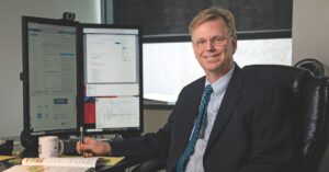 Glenn Sjoden seated at a computer