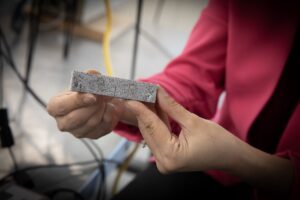 Shahrzad Roshankhah holds a rectangular block of stone between her hands.